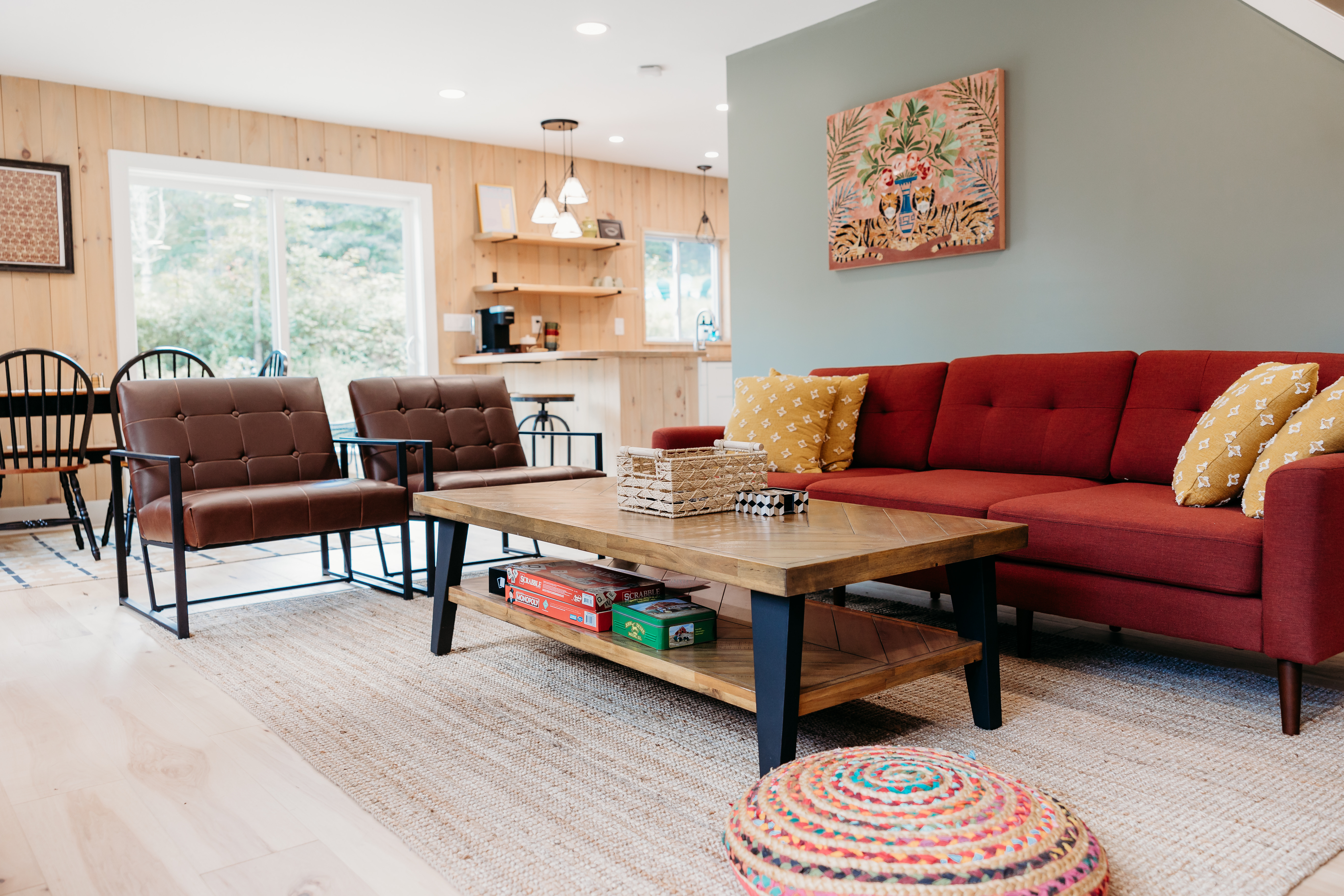 Living room with red sofa and board games